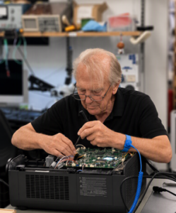 Alan fixing a projector at MBS IT Ltd